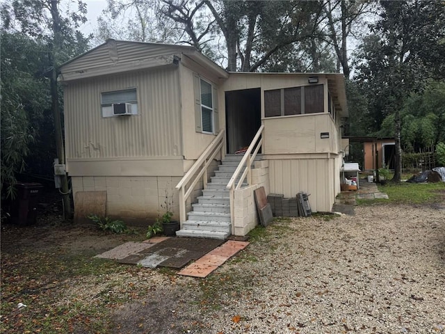 view of front of property with cooling unit