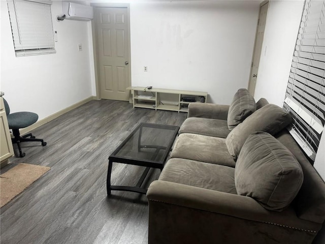 living room with hardwood / wood-style floors and a wall mounted air conditioner