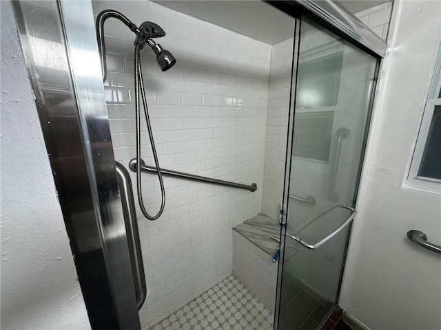 bathroom featuring an enclosed shower