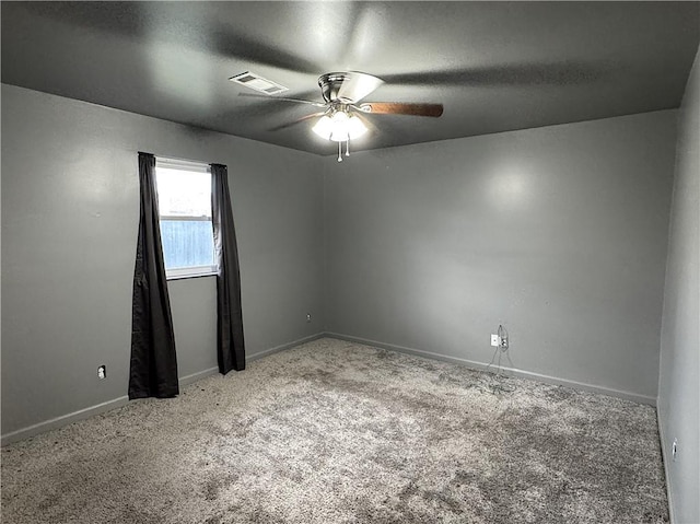 spare room with carpet flooring and ceiling fan