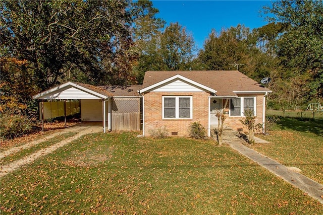 bungalow-style house with a front yard, a carport, brick siding, and crawl space