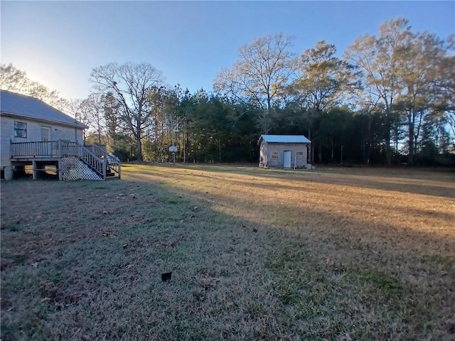 view of yard featuring a wooden deck