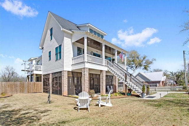 rear view of house with a yard