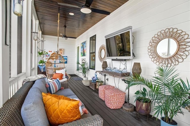 balcony featuring covered porch and ceiling fan