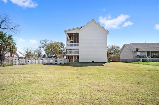 back of property with a lawn