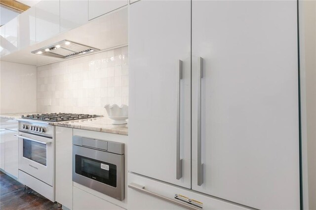 301 S Toulme St Unit 108, Bay Saint Louis, MS 39520 - bedroom featuring beamed ceiling and dark wood-type flooring