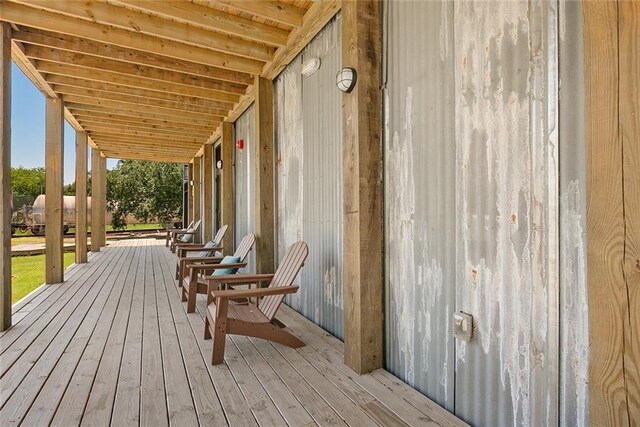 301 S Toulme St Unit 108, Bay Saint Louis, MS 39520 - wooden terrace featuring a porch