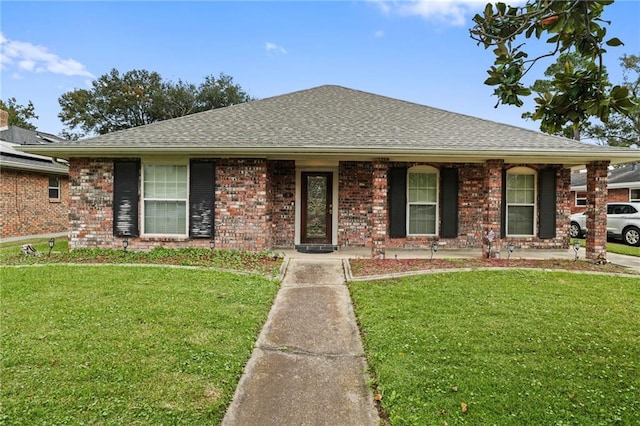 single story home featuring a front yard