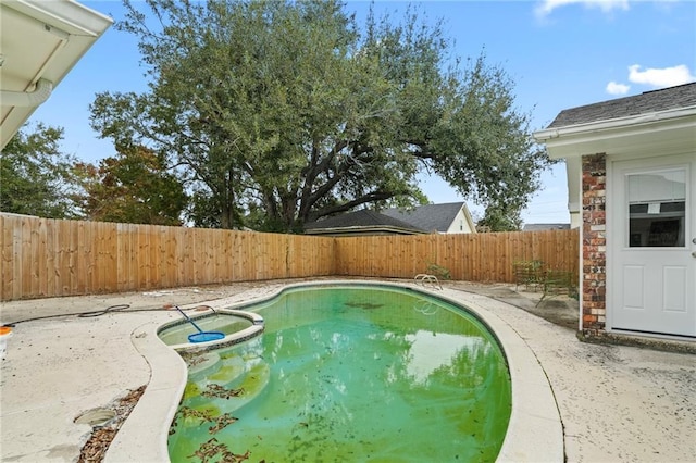 view of pool with a patio area