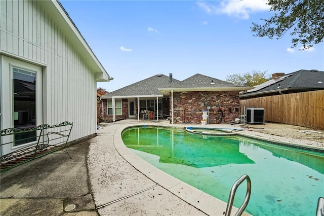 view of swimming pool featuring an in ground hot tub, a patio, and central AC