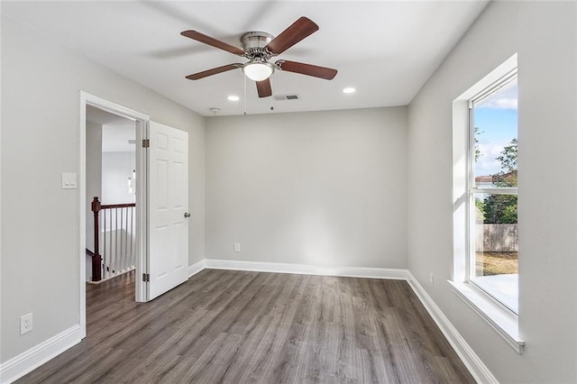 empty room featuring hardwood / wood-style floors and ceiling fan