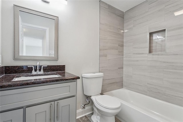 full bathroom featuring vanity, toilet, and tiled shower / bath