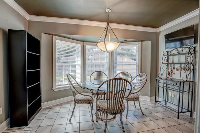 tiled dining space featuring crown molding