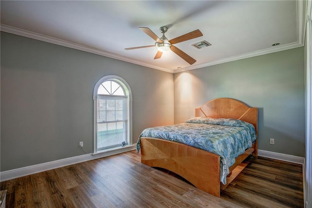 bedroom with ceiling fan, dark hardwood / wood-style flooring, and ornamental molding