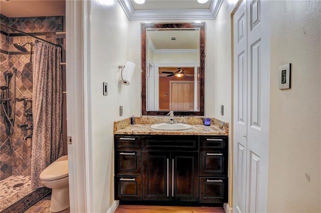 bathroom with ceiling fan, ornamental molding, toilet, vanity, and a shower with shower curtain