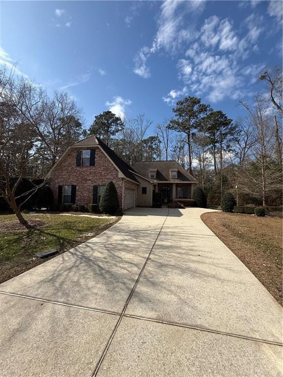 view of home's exterior featuring a garage and a yard