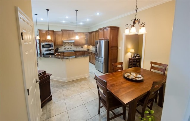 kitchen featuring decorative backsplash, light tile patterned floors, ornamental molding, decorative light fixtures, and stainless steel appliances