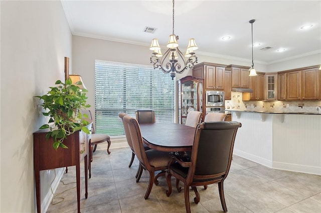 dining space with visible vents, an inviting chandelier, and light tile patterned floors