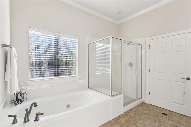 bathroom with a garden tub, a shower stall, and crown molding