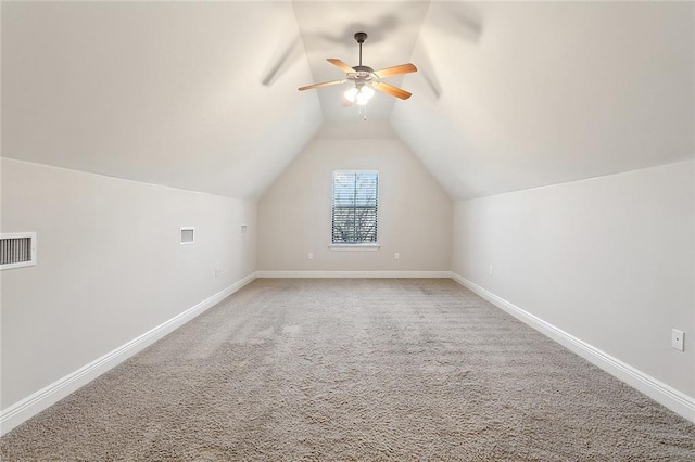 bonus room featuring carpet flooring, vaulted ceiling, baseboards, visible vents, and ceiling fan