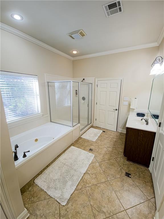 bathroom featuring shower with separate bathtub, vanity, tile patterned floors, and ornamental molding