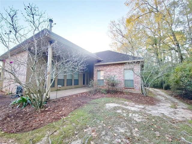 rear view of property with a patio area