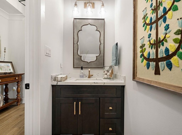 bathroom featuring vanity and hardwood / wood-style floors