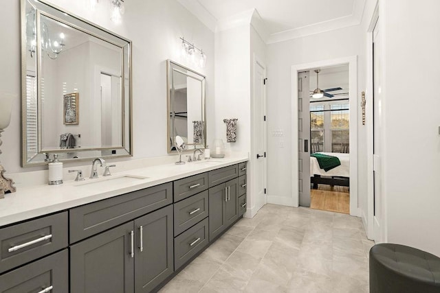 bathroom featuring vanity, tile patterned flooring, crown molding, and ceiling fan