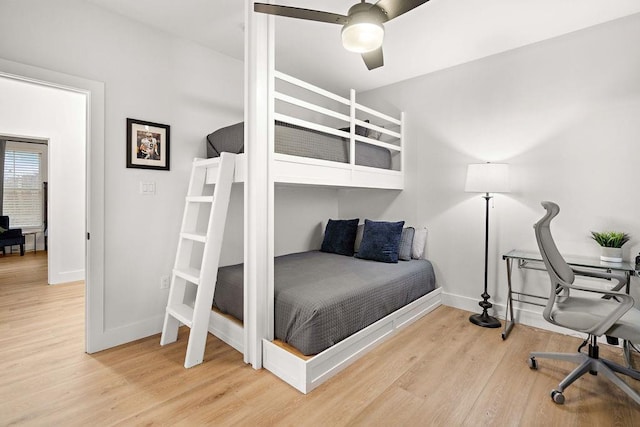 bedroom with hardwood / wood-style floors and ceiling fan