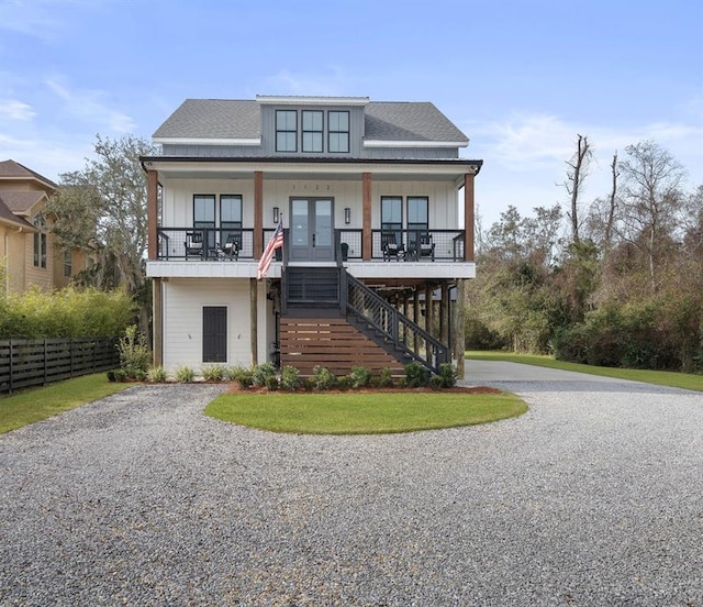 view of front of home featuring french doors and covered porch