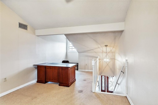 home office with vaulted ceiling with beams and light carpet