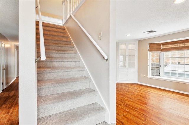 stairs with wood-type flooring