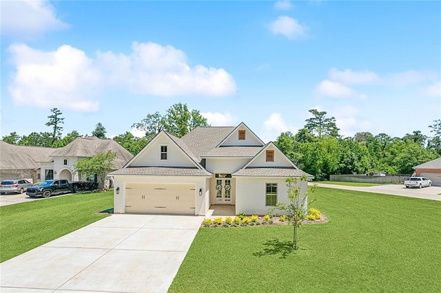 view of front of home featuring a garage and a front lawn