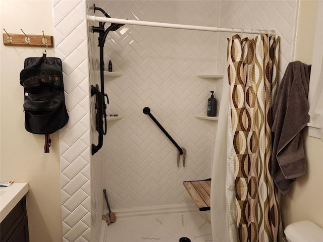 bathroom with toilet and walk in shower