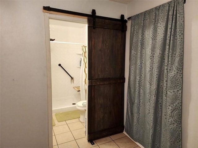 bathroom with toilet, tile patterned floors, and walk in shower