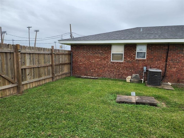 view of yard featuring central air condition unit