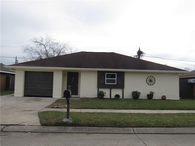 ranch-style home with a garage and a front lawn