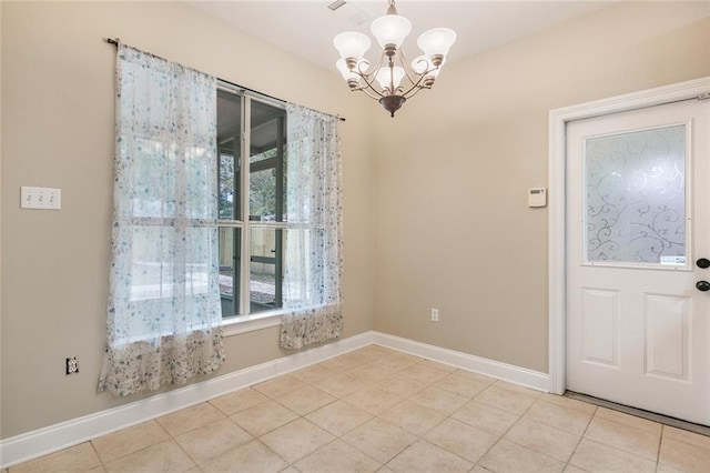 unfurnished dining area featuring light tile patterned floors and a notable chandelier