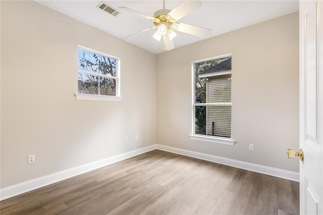 unfurnished room featuring hardwood / wood-style floors and ceiling fan