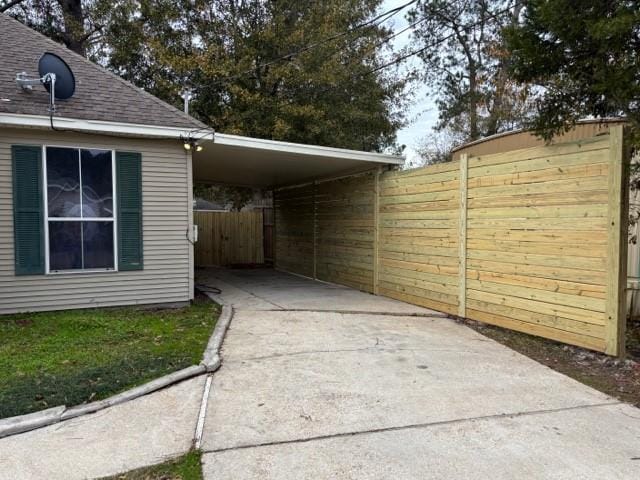 view of car parking featuring a carport