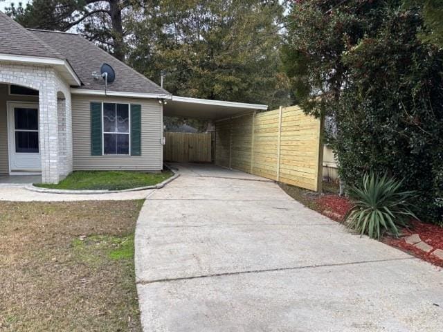 view of home's exterior featuring a carport