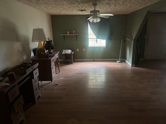 dining space featuring hardwood / wood-style flooring and ceiling fan