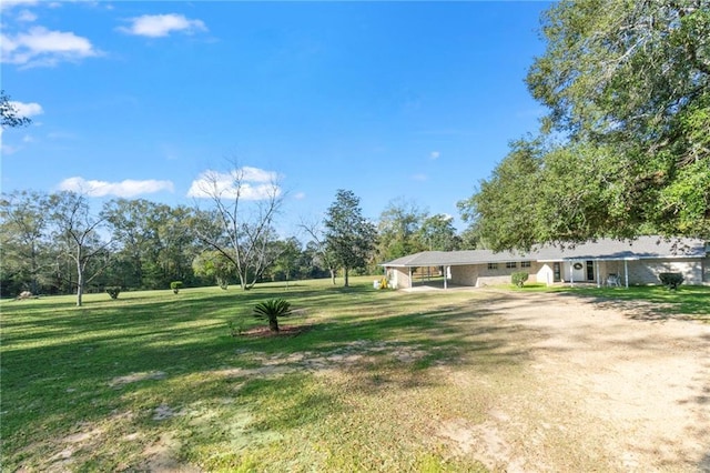 view of yard with a carport