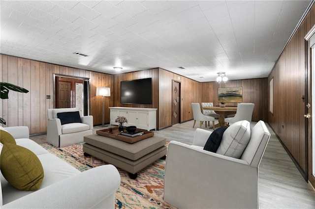 living room featuring wooden walls