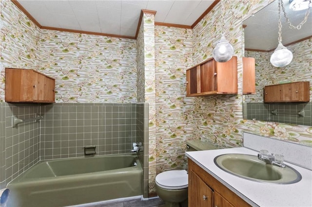 bathroom with vanity, toilet, and ornamental molding