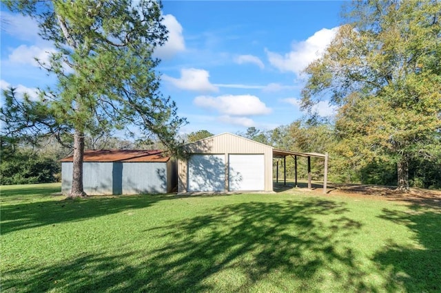 view of yard with an outbuilding and a garage