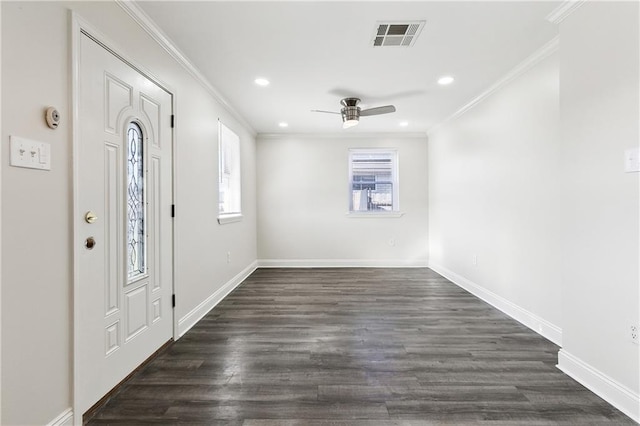 entryway featuring crown molding, dark wood-type flooring, and ceiling fan