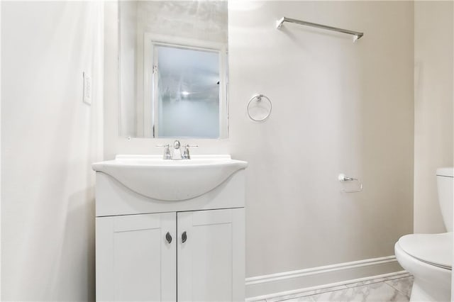 bathroom with vanity and toilet