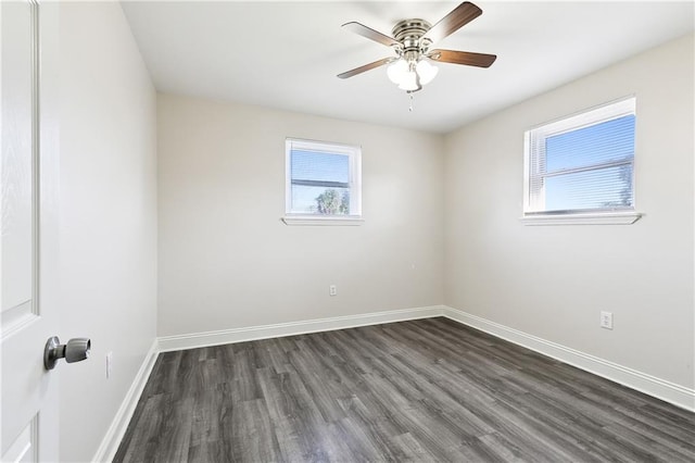 unfurnished room with ceiling fan and dark hardwood / wood-style flooring