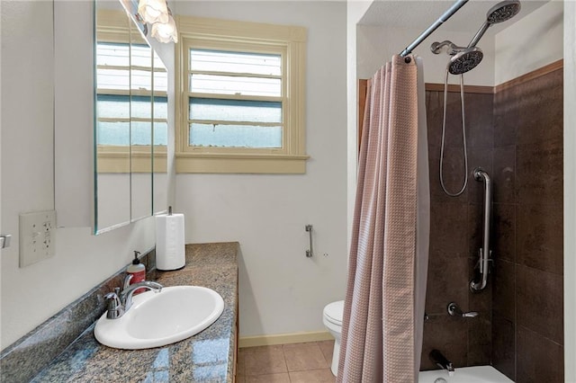 full bathroom with tile patterned flooring, shower / tub combo with curtain, toilet, vanity, and baseboards